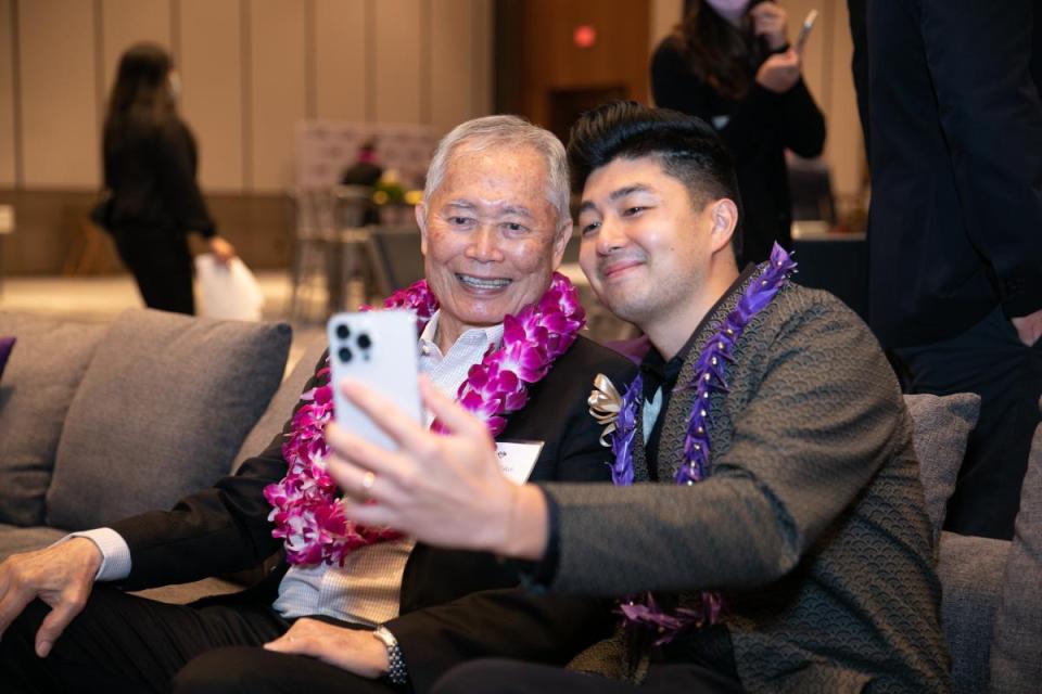 Alec Nakashima taking a selfie with George Takei